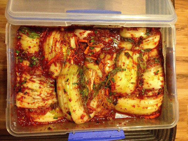 Store your kimchi in a BP-free plastic container or glass or earthenware jars.