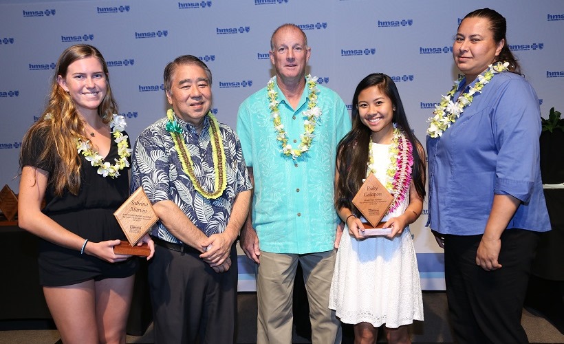 Big Island Interscholastic Federation (BIIF) scholarship and school winners with HMSA's Executive Vice President and Chief Health Officer Dr. Mark Mugiishi (left to right):  1. Sabrina Marvin, Hawaii Pacific Academy 2. Dr. Mark Mugiishi 3. Gregory Dunigan, PE Teacher and Boys Basketball and Vollyeball Coach - Parker School 4. Ruby Galapon, Keaau High School 5. Iris McGuire, Athletic Director - Keaau High School 