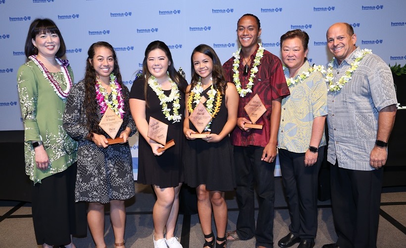 Interscholastic League of Honolulu (ILH) scholarship and school winners with HMSA's Executive Vice President and Chief Governance and Corporate Services Officer Janna Nakagawa (left to right):  1. Janna Nakagawa 2. Kanani Uluave, Kahuku High & Intermediate School 3. Michele Fujita, Pearl City High School 4. Joey Pantil, Nanakuli High & Intermediate School 5. Elray Santiago Jr., Campbell High School 6. Stacie Nii, Athletic Director - Waipahu High School 7. Mark Brilhante, Athletic Director - Kalaheo High School